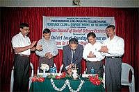 Ponnampet Forest College Dean N A Prakash inaugurating a seminar on tourism in Madikeri on Wednesday. DH Photo