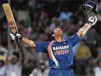 Cause Celebre: Sachin Tendulkar exults after scoring a world record double century during the second ODI at the Captain Roop Singh Stadium in Gwalior on Wednesday. Replying to Indias 401 for 3, South Africa made 248 runs . AFP