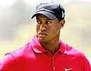 Wife refuses to pose with Tiger Woods, uncommitted on marriage