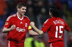 Liverpool's Steven Gerrard, left, reacts after scoring against Unirea Urziceni with Yossi Benayoun, right, during the second leg of their Europa League round of 32 match in Bucharest, Thursday, Feb. 25, 2010. (AP Photo/Vadim Ghirda)