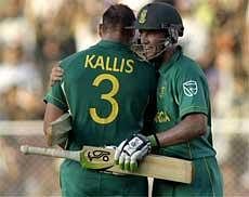 South Africa's A.B. de Villiers, right, congratulates his team's captain Jacques Kallis on scoring a century in the third one day cricket match against India, in Ahmedabad on Saturday. AP