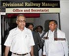 Minister of State for Railways K H Muniyappa and Divisional Railway Manager Akhil Agrawal arriving for a press meet in Bangalore on Saturday. KPN