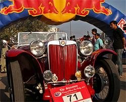 A vintage car makes its way for a car rally in New Delhi on Sunday. PTI