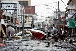 A boat lies marooned on a street in Talcahuano, Chile, on Monday, after an 8.8-magnitude earthquake on Saturday triggered a tsunami. AP