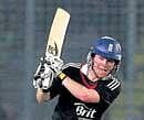 Englands Eoin Morgan hits a boundary during his unbeaten century against Bangladesh on Tuesday. REUTERS