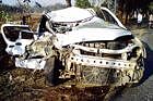 Mangled remains of the car which met with a head-on collision with a lorry on NH 48 near Bidanagere, Kunigal on Tuesday. DH Photo