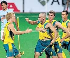 Australias Glenn Turner (second from left) celebrates with team-mates after scoring a goal against India in their hockey World Cup match at New Delhi on Tuesday. Australia won the match 5-2. Reuters