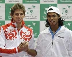 Russia's Davis Cup player Igor Andreev, left and India's Davis Cup player Somdev Devvarman pose after the draw for their upcoming Davis Cup match in Moscow on Thursday. AP