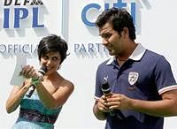 Cricketer Rohit Sharma with TV anchor Mandira Bedi at the unveiling of "2010 Citi Under-23 Success of the League Trophy" in New Delhi on Saturday. PTI