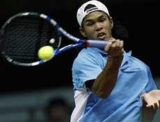India's Somdev Devvarman returns a ball to Russia's Mikhail Youzhny, unseen, during their Davis Cup World group first round tennis match in Moscow. AP