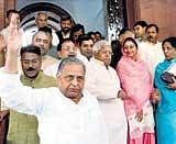 We oppose:  Shiromani Akali Dal MP Harsimrat Kaur smiles as Samajwadi Party chief Mulayam Singh Yadav and RJD Chief Lalu Prasad come out of Parliament protesting against Women's Reservation Bill in New Delhi on Monday. PTI