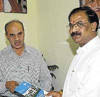 Minister for Higher Education Aravind Limbavali handing over a copy of  Karnataka Examination Authoritys (KEA) Informatiion Brochure for Common Entrance Test 2010 for admission to professional courses to KEA Executive Director Shankar Narayan on Monday. DH Photo