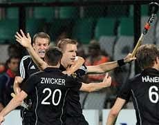 German hockey player Linus Butt (C) celebrates with teammates after scoring a goal against England during their World Cup 2010 semifinal match at the Major Dhyan Chand Stadium in New Delhi on Thursday. AFP