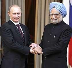 Prime Minister Manmohan Singh with Russian Prime Minister Vladimir Putin in New Delhi on Friday. AP