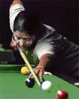 focussed: Karnatakas Chitra Magimairaj en route to her win over Maharashtras Meenal T on Friday. DH photo.