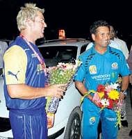 Friends and foes: Shane Warne (left) and Sachin Tendulkar arrive for the IPL-III inauguration in Mumbai on Friday. PTI