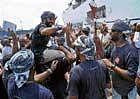 Crew members of Jewel of Muscat celebrate at Kochi Port on Monday soon after their arrival. PTI