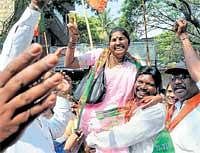 Exuberant: BJP supporters celebrating during nomination filing at Shivajinagar BBMP office, Queens Road  in Bangalore on Monday. DH Photo