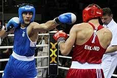 Indian boxer Vijender Singh blows a punch on his opponent Frank Buglioni of England in the final match of the middle 75 kgs category at Commonwealth Boxing Championship 2010, in New Delhi on Wednesday. Vijender Singh won the match. PTI