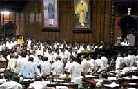 Free for all: Opposition legislators staging a dharna in the well of the Legislative Assembly over the issue of Alliance University bill in Bangalore on Wednesday. DH Photo