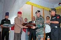 Retired Lieutenant General B C Nanda handing over Odikathi, a traditional sword of Kodavas to Lieutenant General Pradeep Khanna on Thursday during the seminar organised by ex-servicemen at Madikeri. Kodagu District Ex-Servicemen Association President B A Karyappa, retired colonel N K Appayya, DC Ashwathnarayana Gowda and others look on. DH Photo