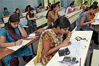 D-Day: Science and Commerce students writing their II PU examinations at a college in Bangalore on Thursday. DH Photo