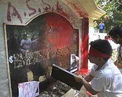 Burmese protesters deface the nameplate of their embassy during a protest in New Delhi, on Friday, March 19, 2010. AP Photo