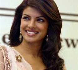 Actress Priyanka Chopra smiles during the release of her father's album 'Haal Mureeddan da Kehna', in New Delhi on Saturday.The income generated with sale of the album will be provided to 'Save the Girl Child' campaign. PTI