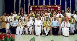 Yakshagana Academy award winners along with Dharmastala Dharmadhikari D Veerendra Heggade and other dignitaries in Dharmasthala on Sunday. dh photo