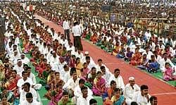 till death do us apart: The newly-married couples at the mass wedding organised by MLA Santosh Lad at Kalghatagi in Dharwad district on Monday. dh Photo