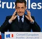 French President Nicolas Sarkozy gestures while speaking during a final press conference at an EU summit in Brussels, Friday March 26, 2010.
