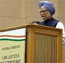 Prime Minister Manmohan Singh addressing the gathering during the national convention on 'Law, Justice & the Common Man' at Vigyan Bhawan in New Delhi on Saturday. PTI