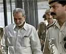 Congress leader Sajjan Kumar leaves after appearing in the Karkardooma court in connection with a 1984 Sikhs riots' case, in New Delhi on Saturday. PTI