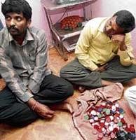 The two arrested on Saturday for allegedly distributing silver coins to woo voters in Bangalore. DH PHOTO