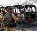 A bus set on fire by suspected Maoists at Jhilmil forest area in Bankura district of West Bengal on Saturday. PTI