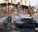 Security personnel keep vigil after communal clashes erupted at Gowliguda in Hyderabad on Sunday. PTI