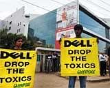 Greenpeace activists hold placards in front of the Dell India office in Bangalore on Monday. AFP