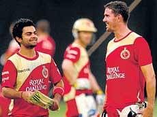 WELCOME BACK! Virat Kohli (left) and Kevin Pietersen in a jovial mood during the Royal Challengers Bangalores practice session on Monday. DH PHOTO