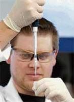 Genevolution: Bio Technician Jason Mitchell demonstrates pipetting in the sequencing laboratory at the J Craig Venter Institute in Rockville, Maryland, on Monday. Reuters