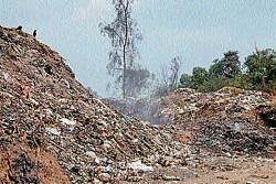 Waste being dumped near Stone Hill in Madikeri. (Below) CMC constructing a godown to store the plastic segregated from the wastes dumped at Stone Hill.  dh photo