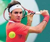 ELEGANT:  Roger Federer returns during his third round win over Florent Serra in Miami Masters on Monday. DH