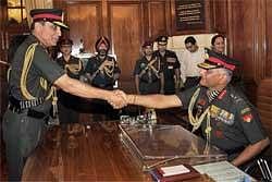 Outgoing Army Chief General Deepak Kapoor (L) shakes hands with his successor Gen V K Singh as the latter assumes charge in New Delhi on Wednesday. PTI