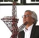 Artist Anish Kapoor looks at a model of his design of the ArcelorMittal Orbit, during a press conference, in London on Wednesday. AP