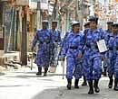 RAF personnel patrol a street in the curfew bound old city of Hyderabad on Wednesday. PTI