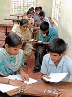 Scribes assisting visually challenged students in SSLC exam at a centre in Mysore on Thursday. KPN