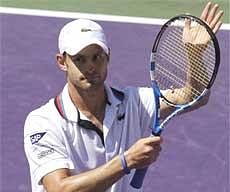 Andy Roddick of the United States, raises his racket after defeating Rafael Nadal Key Biscayne, Fla., Friday. AP
