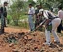 Bomb Disposal Squad inspecting the spot after a landmine bast at Bamal under Lalgarh Police Station in West Midnapore district on Saturday. PTI