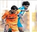Chandnis Javed OK  (left) and Golden Threads Ajith Fermin vie for possession  in a I-League Second Division match in Bangalore on Saturday. DH Photo