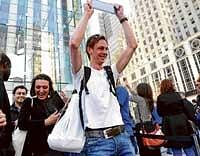 Got it: Mike Heinsius, of Rotterdam, the Netherlands, holds up his new iPad outside the Apple Store on Fifth Avenue in New York on Saturday. AP