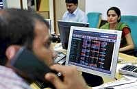 Brokers trading at a brokerage in Mumbai on Monday. AFP